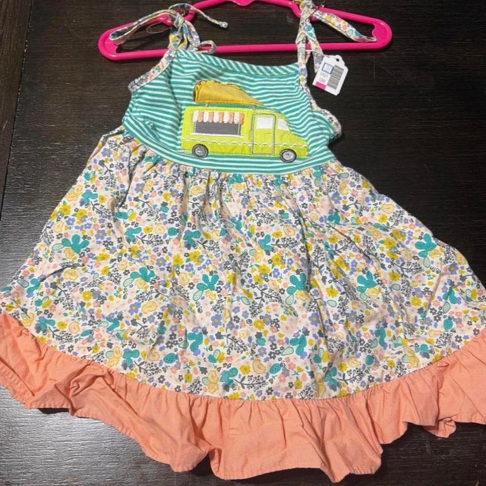RicRac & ruffles 2T taco truck dress. Never worn, tags just taken off'